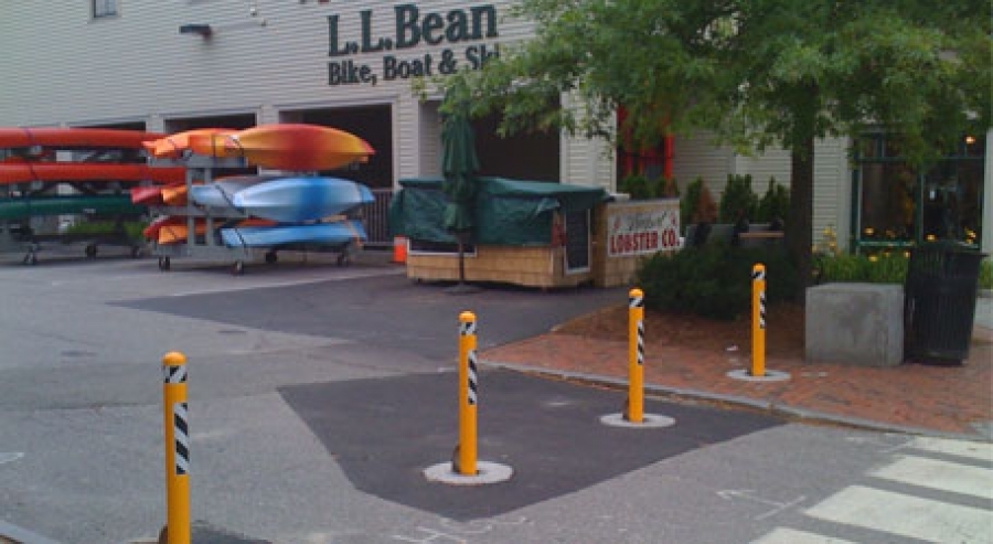 Removable bollards protecting a retail storefront entrance