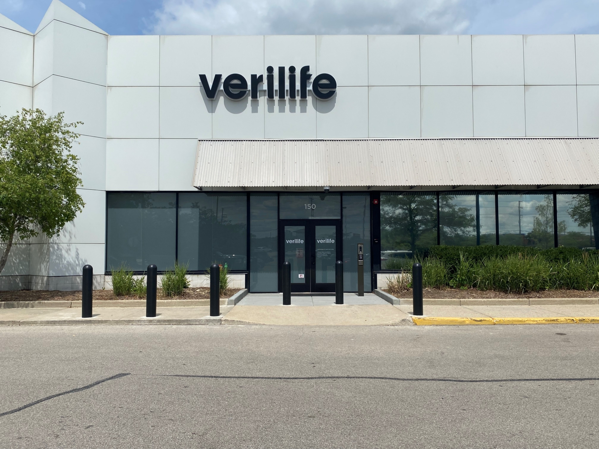 20 MPH Core-In bollards in front of the Verilife retail storefront