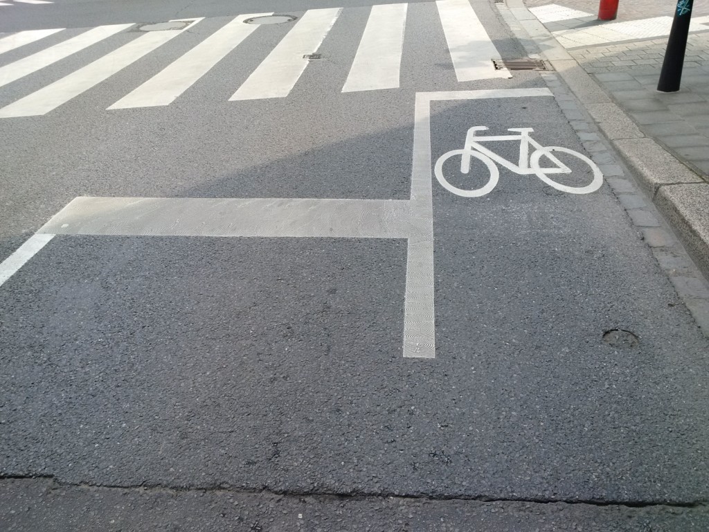 crosswalk and bicycle lane street markings